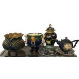 A MAJOLICA JARDINIÈRE Along with another figured putti, a large novelty teapot and three pieces of