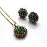 A VINTAGE 9CT GOLD, DIAMOND AND EMERALD PENDANT AND EARRINGS SET Having a cluster of round cut