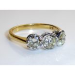 AN 18CT GOLD AND DIAMOND THREE STONE RING Having an arrangement of graduating oval cut stones,