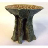 A 20TH CENTURY STUDIO POTTERY TAZZA BOWL Organic form with brown glaze interior and green support,