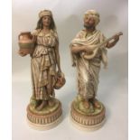 A PAIR OF 19TH CENTURY AUSTRIAN PORCELAIN FIGURES Modelled as seated man holding a lute and a