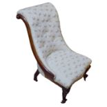 A VICTORIAN ROSEWOOD SLIPPER CHAIR Having a carved scrolled back with cream and gilt upholstery,