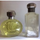 TWO VINTAGE FACTICE SHOP DISPLAY VERSACE OVAL PERFUME BOTTLES With concave Romanesque mask and Greek