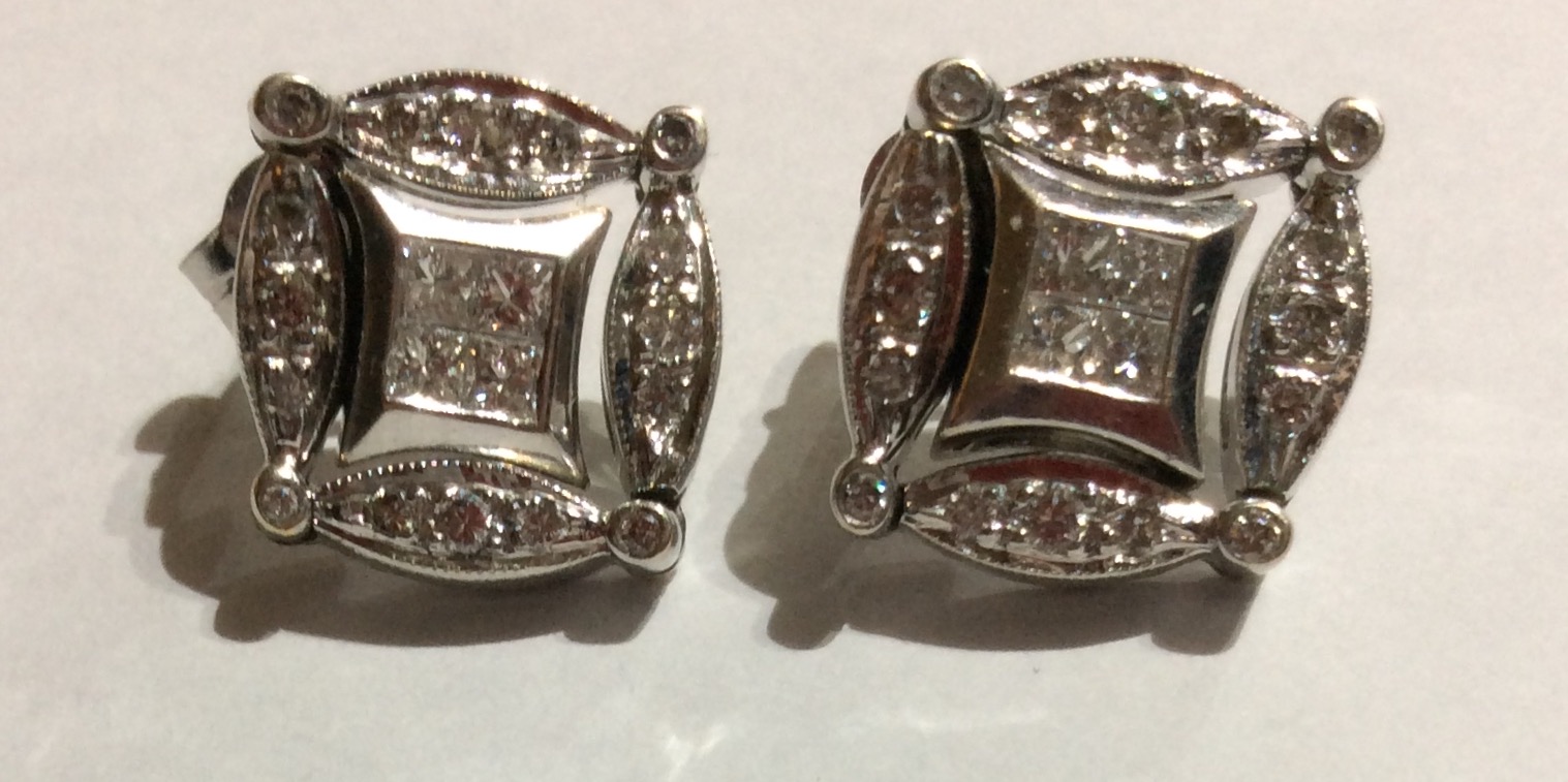 A RARE PAIR OF WHITE METAL AND DIAMOND METAMORPHIC EARRINGS Set with an arrangement of Princess