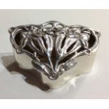AN EARLY 20TH CENTURY SILVER TRINKET BOX Having Art Nouveau style pierced floral decoration to