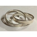 TIFFANY & CO., A SILVER CROSSOVER RING Marked to outer edge 'T and Co. 925', retaining original