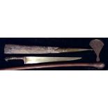 A 19TH CENTURY PERSIAN STEEL AND RHINO HORN DAGGER The horn handle having a steel hanger with