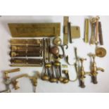 A COLLECTION OF EARLY 20TH CENTURY BRASS DOOR FURNITURE Including spherical knobs, door locks and