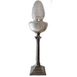 A 20TH CENTURY WHITE METAL TABLE LAMP With cut glass shades over reeded and fluted column, raised on