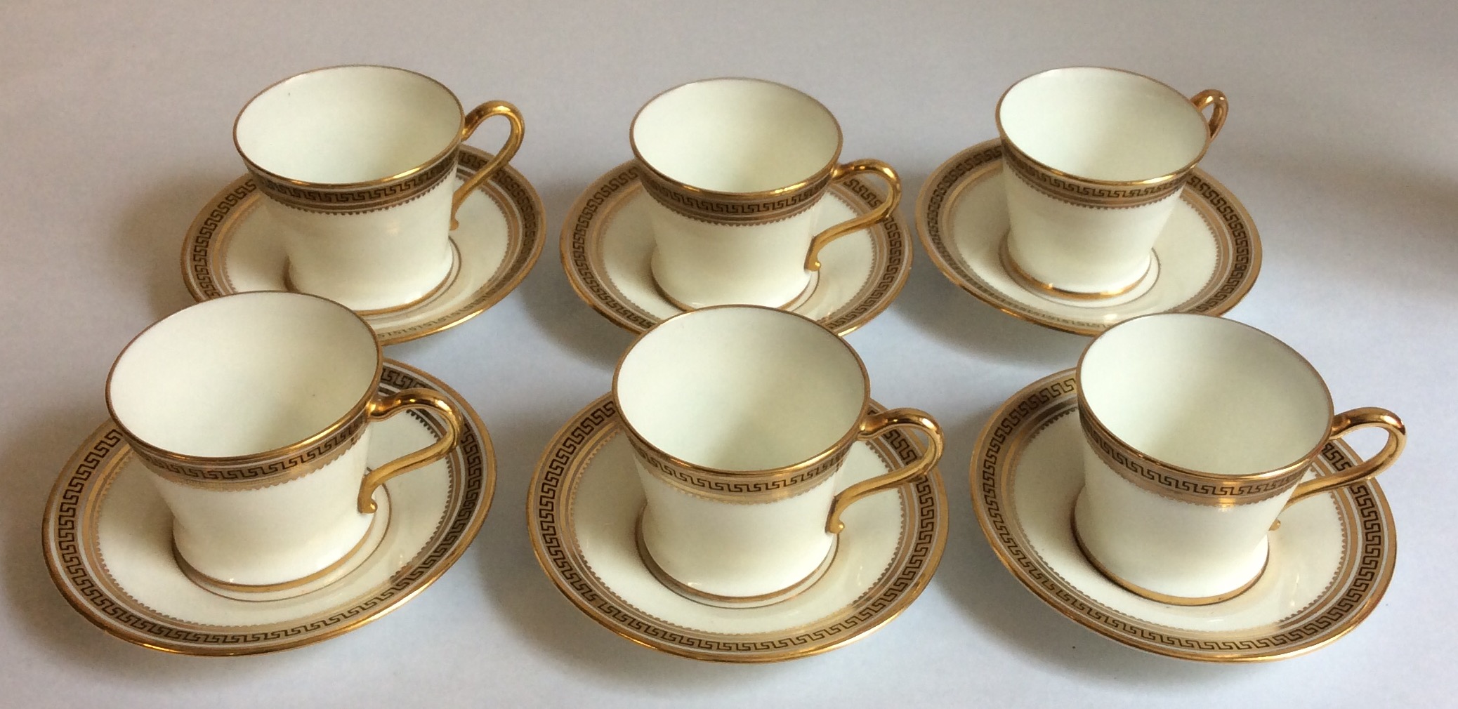 A CASED EARLY 20TH CENTURY PORCELAIN COFFEE SERVICE To include six cups and saucers, having gilt