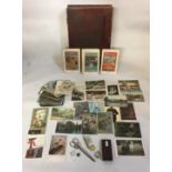 A LATE VICTORIAN BOX CONTAINING A COLLECTION OF LATE 19TH/EARLY 20TH AUSTRO HUNGARIAN POSTCARDS