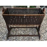 A GOOD VICTORIAN MAHOGANY LATTICEWORK SWING CRIB.