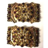 TWO VINTAGE YELLOW METAL AND GARNET SET BUCKLES Having an arrangement of round cut garnets forming a