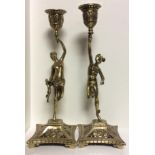A PAIR OF 19TH CENTURY BRASS FIGURAL CANDLESTICKS Figured as Greek Gods Mercury and Aphrodite,
