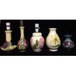 MOORCROFT, A COLLECTION OF 20TH CENTURY POTTERY LAMPS AND VASES Two lamps decorated with purple