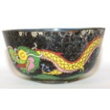 A CHINESE CLOISONNÉ BOWL Black ground with dragon and flaming pearl design and blue interior. (