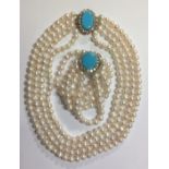 A VINTAGE FOUR STRAND PEARL AND GEMSTONE NECKLACE Having a yellow metal gem set clasp, together with