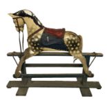 AN EARLY 20TH CENTURY ROCKING HORSE. (h 104cm x l 120cm x d 40cm)