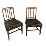 A PAIR OF GEORGIAN STYLE MAHOGANY STANDARD CHAIRS With overstuffed upholstered seats, raised on