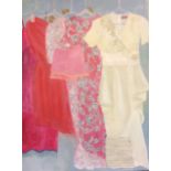 G. FLEMING, A 20TH CENTURY OIL ON CANVAS Featuring a rack of clothes, including a wedding dress