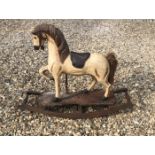 A VICTORIAN STYLE WOOED ROCKING HORSE. (80cm x 64cm)