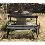 A MID 20TH CENTURY TEAK AND WROUGHT IRON GARDEN BENCH With scroll arms and legs. (121cm x 60cm x