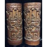 A PAIR OF CHINESE BAMBOO BRUSH POTS Finely carved with a garden scene with elders. (approx 30cm)