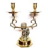 A PAIR OF BRASS TWIN BRANCH CANDLESTICKS Figured with heraldic lions, along with hobnail cut