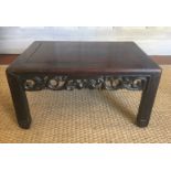 A 19TH CENTURY CHINESE HARDWOOD LOW TABLE With pierced frieze, raised on carved square section legs.