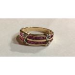 A VINTAGE 9CT GOLD, RUBY AND DIAMOND HALF ETERNITY RING Having two parallel lines of square cut