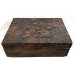 A CHINESE HARDWOOD BOX The lid carved with a dragon amongst clouds. (w 44cn x h 14cm x d 31cm)
