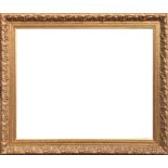 A LARGE 18TH CENTURY DESIGN CARVED GILT FRAME Having scrolled leaf design with egg and dart