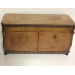 A 20TH CENTURY MAHOGANY TEA CADDY Having a marquetry inlaid top and containing a central jar and