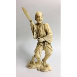 A 19TH CENTURY IVORY OKIMONO Carved as a peasant holding a machete. (h 17cm)