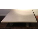 A LARGE STONE TOP COFFEE TABLE On a painted and carved base. (120cm x 120cm x h 45cm)