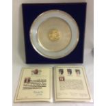 A 20TH CENTURY SILVER AND 22CT GOLD COMMEMORATIVE CHARGER/PLATE Issued by the College of Arms on the