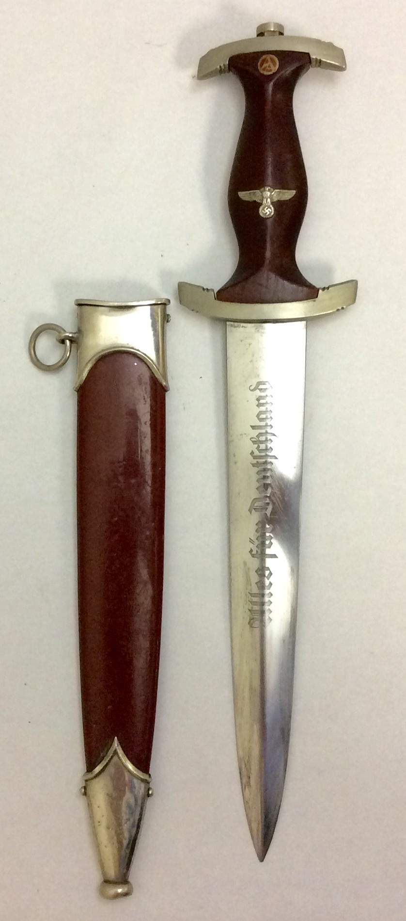 AN EARLY 20TH CENTURY GERMAN SA DAGGER Having a brown handle with nickel plated fittings and