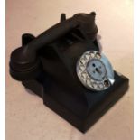 A MID 20TH CENTURY BLACK BAKELITE TELEPHONE With rotary dial.