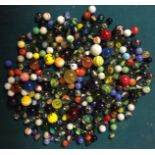 A QUANTITY GLASS MARBLES Possibly with some Victorian examples of varying sizes and colours. (approx