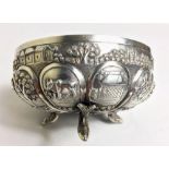 A 20TH CENTURY WHITE METAL BOWL With embossed decoration depicting trees, figures and cattle. (h 6.