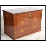 A 20TH CENTURY INDIAN ROSEWOOD MULE CHEST With foliate brass inlay over two short drawers. (w 92cm x