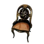 JENNINGS & BETTRIDGE, A 19TH CENTURY PAPIER MACHE AND MOTHER OF PEARL SPOON BACK CHAIR With caned