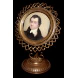 AN EARLY 19TH CENTURY MINIATURE PORTRAIT Of a gentleman, contained in a later gilt metal starburst