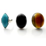 A COLLECTION OF THREE VINTAGE SILVER AND GEM SET RINGS To include cabochon cut stones, black onyx