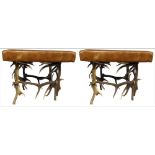 A PAIR OF TAN LEATHER STOOLS With antler bases. (61cm x 61cm x h 50cm)