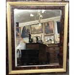 AN EARLY 20TH CENTURY MIRROR With faux walnut painted frame. (94cm x 110cm)