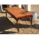 A 19TH CENTURY FRENCH FRUITWOOD DRAW LEAF EXTENDING DINING TABLE With four plank top, raised on