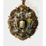 MASONIC INTEREST, A SILVER GILT AND ENAMELLED MASTER CLOCK MAKER'S BADGE With the image of a clock