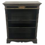 AN EBONISED FRENCH EMPIRE DESIGN BOOKCASE With floral gilt metal mounts and open shelves, raised