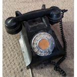 A MID 20TH CENTURY BLACK BAKELITE TELEPHONE Wired for contemporary use.